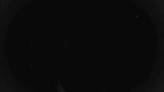 Abstract dark background vintage film effect on man face