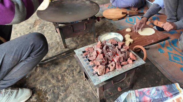 Traditional Indian Roti Roasted Over Charcoal with Flatbread Cooking on Iron Tawa