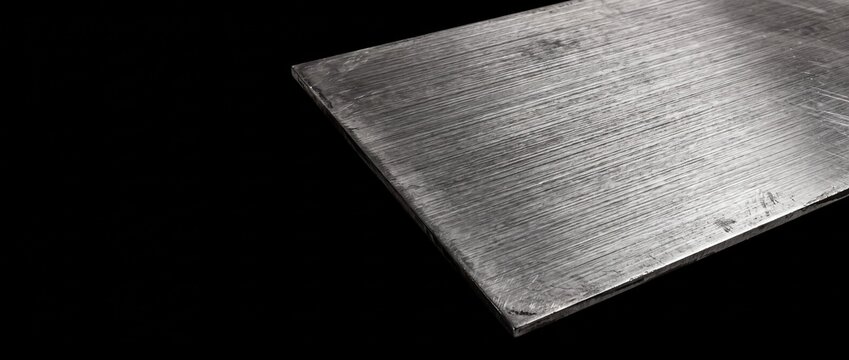 Brushed Stainless Steel Sheet With Fine Grain Lines On Black Background