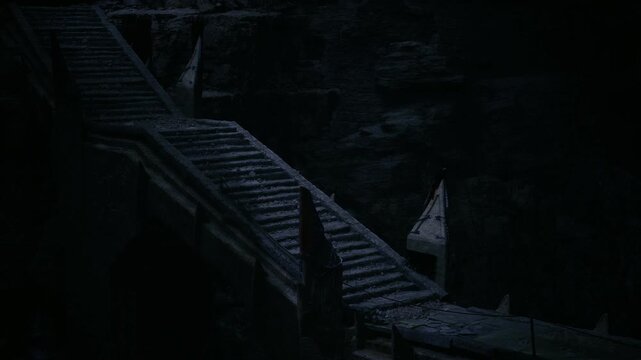 Nocturne stair corridor carved from basalt, slender beams of pale light at far end, cracked banister, oppressive hush evoking solitude and reverie