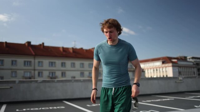 Young athlete runs outdoors during an intense cardio workout pushing his pace and testing endurance while building stamina speed and physical fitness through regular training