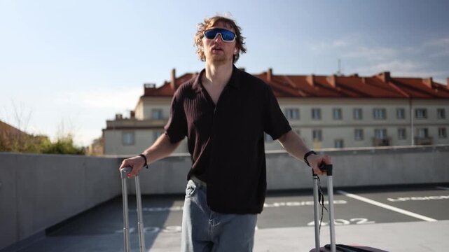 Young man runs with two suitcases excited for vacation as he rushes toward departure ready to escape routine and enjoy his long awaited holiday filled with new adventures