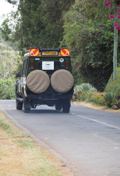 Rear View of Custom Green Toyota Land Cruiser Safari Tour Vehicle with Dual Spare Tires