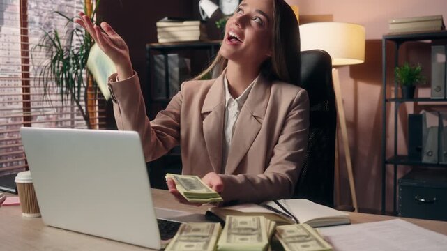 Happy smiling Caucasian business woman investor trader holding fan of money wave throwing away banknotes throw cash rich female girl smile businesswoman enjoying financial bet casino jackpot at office