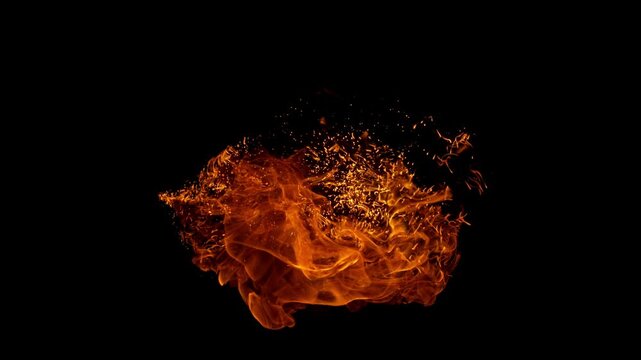 Small fire explosion with glowing sparks and embers isolated on a black background. Dynamic flames and combustion effects captured in high detail for dramatic visual impact.