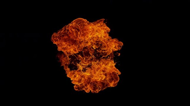 Small fire explosion with glowing sparks and embers isolated on a black background. Dynamic flames and combustion effects captured in high detail for dramatic visual impact.