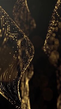 Elegant abstract golden light particles flowing through a dark background, creating a luxurious cinematic motion background for advertising and creative projects.