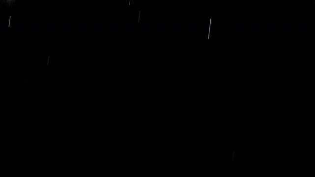 Super slow motion of natural rain drops falling on black background