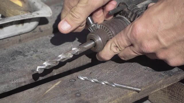 Fabrication of a custom shock-absorption system for an electronic stabilizer and video camera for motorcycle mounting; drilling weight-reduction holes in aluminum parts