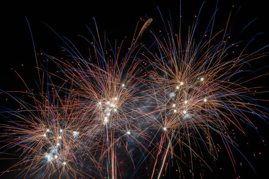 Bright Colorful Fireworks Display in Black Night Sky for Celebration