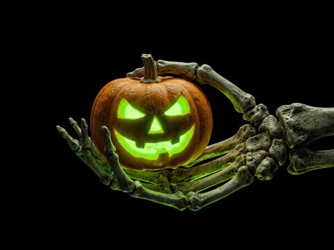 Luminous Grasp: Realistic Skeleton Hand Holding Glowing Jack-o'-Lantern""Neon Macabre: Isolated Skeletal Hand with Miniature Glowing Pumpkin"