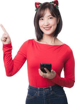 Happy young asian woman holding smartphone pointing finger up for christmas sale and black friday promotion standing isolated against transparency background