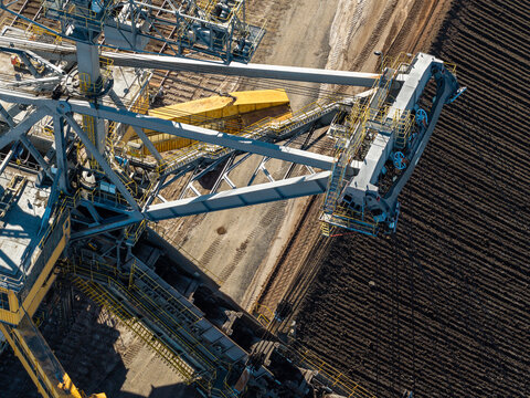 Aerial view of the massive bucket-wheel excavator at Tagebau Welzow-Sud brown coal open-pit mine, showing industrial machinery and excavated earth in Spremberg, Brandenburg, Germany.