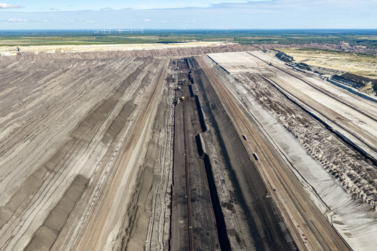 Aerial view of the Tagebau Welzow-Sud brown coal open-pit mine showing extensive excavation layers and industrial landscape in Spremberg, Brandenburg, Germany.