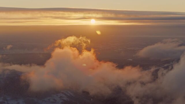 Beautiful Sunset with Orange Tint , Aerial Shot Above Clouds