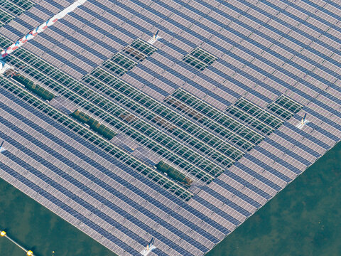 Aerial view of the floating solar park at Cottbuser Ostsee, showing solar panels and structural gaps from storm damage at the former open pit mine in Cottbus, Brandenburg, Germany.