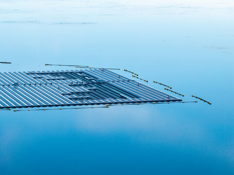 Aerial view of the floating solar system at Cottbuser Ostsee, a former open pit mine currently undergoing repair works after storm damage, in Cottbus, Brandenburg, Germany.