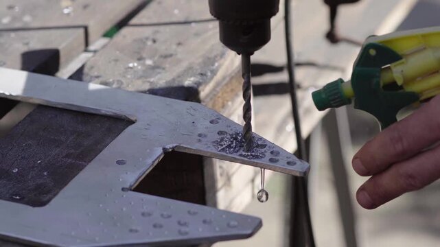 Fabrication of a custom shock-absorption system for an electronic stabilizer and video camera for motorcycle mounting; drilling weight-reduction holes in aluminum parts