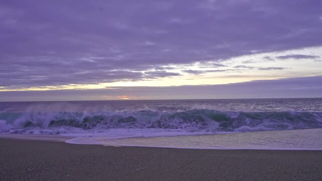 Powerful Atlantic waves crashing onto the sandy beach of Nazare