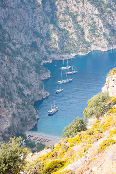 Tourists visit famous Butterfly Valley beach - Oludeniz, Turkey
