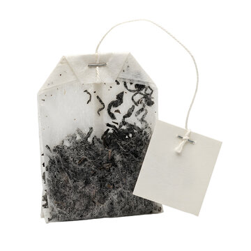 Single high-quality black tea bag featuring a blank white paper tag and cotton string for brand mockup, isolated on a white transparent background for beverage industry graphic design.