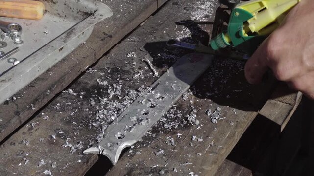 Fabrication of a custom shock-absorption system for an electronic stabilizer and video camera for motorcycle mounting; drilling weight-reduction holes in aluminum parts