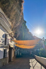 Setenil de las Bodegas is a famous cave house town featuring homes built beneath massive rock overhangs in Cadiz, Andalusia, Spain  © Olga Biliak