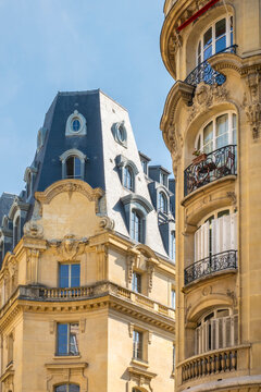 Haussmann-era apartment buildings with mansard roofs and wrought iron balconies, Paris, France