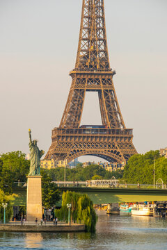 Eiffel Tower with replica Statue of Liberty on the Ile aux Cygnes and River Seine, Paris, France