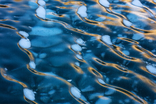 Ice ripples and methane ice bubbles under clear ice on Abraham Lake near Nordegg, Alberta, Canada.