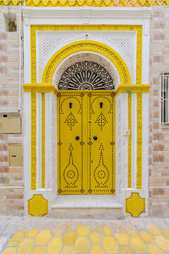 Ornate yellow door in a traditional house, Kairouan, Tunisia