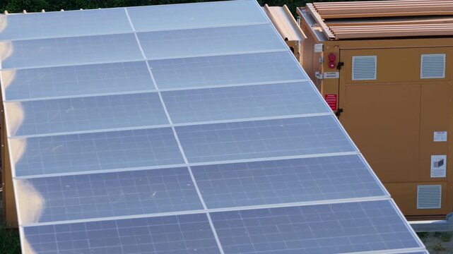 Aerial view of solar panel array and technical enclosure in Faenza, Emilia-Romagna, Italy.