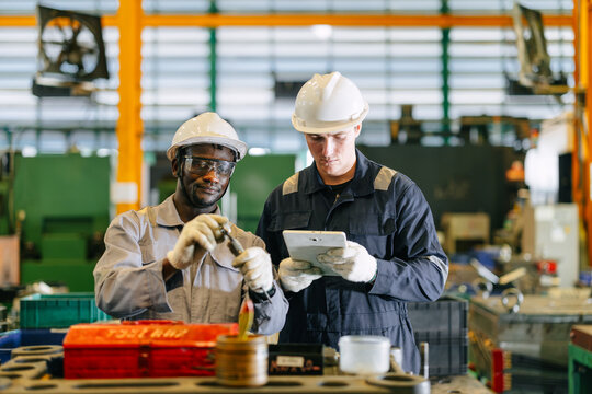 African Black Engineer Male Worker Working with Caucasian Young Man Support Assist Together in Plant