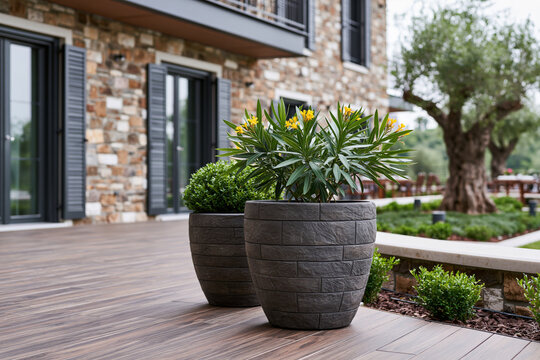 Modern artwork of rugged outdoor garden planters crafted from textured stone composite displayed on a landscaped terrace, elegant greenery, natural daylight