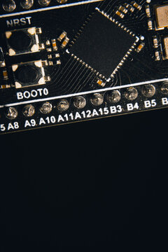 A close-up of a microcontroller; a series of photos on the topic of hardware and embedded systems.