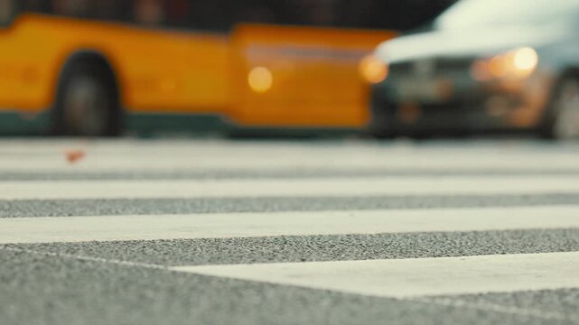 Traffic at a busy crosswalk with cars moving slowly in an urban area