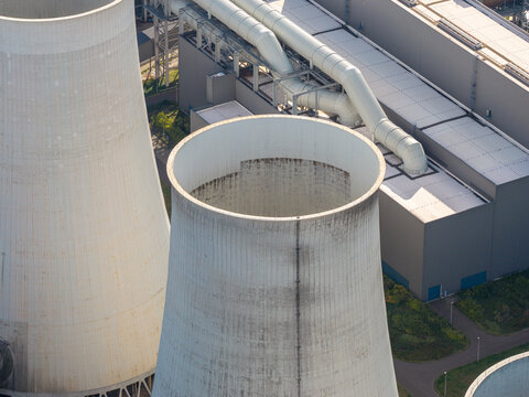 Aerial view of the cooling towers at the Janschwalde Power Station, showing industrial infrastructure and pipes in Peitz, Brandenburg, Germany.