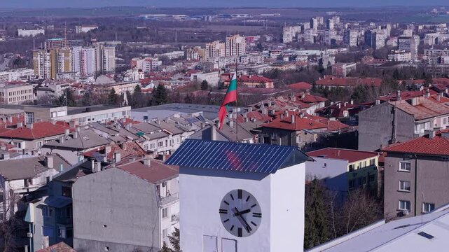 Aerial view of the clock tower with a Bulgarian flag overlooking the city of Shumen, Shumen Province, Bulgaria.