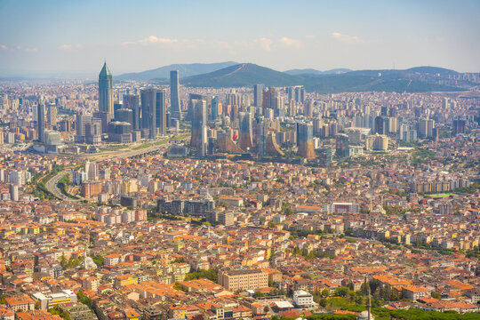 Panoramic view of Istanbul skyline featuring modern skyscrapers, historical buildings, and the Bosphorus Strait in Turkey on a clear sunny day Istanbul, Turkey