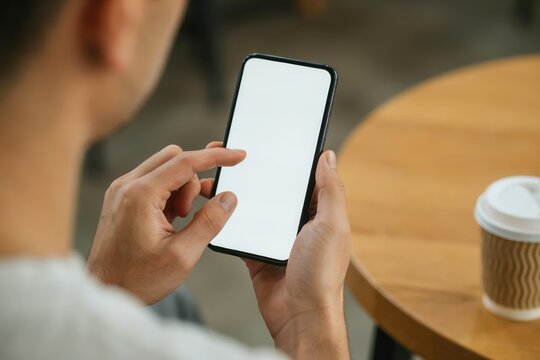 Man using smartphone with mockup screen