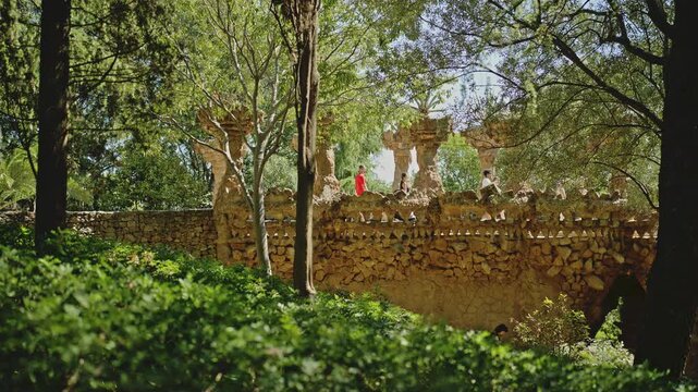 Gaudi Stone Viaduct Hidden in Lush Park Guell Barcelona.Filmed on on 15 September 2026.