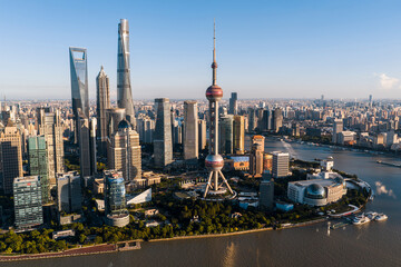 Obraz premium Aerial view of Shanghai CBD, featuring the iconic and soaring skyscrapers. This grand urban landscape reflects China's strong economic vitality. 