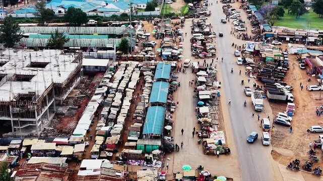 Panoramic view of the drone flying over the concentrated slum houses of rural village in Kenya. Aerial view of a poorly concentrated village in Africa slum of kiminini.