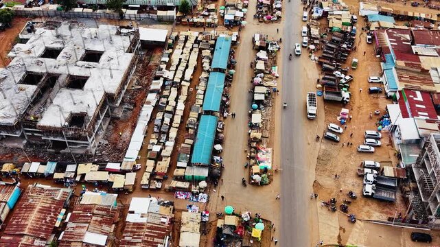 Panoramic view of the drone flying over the concentrated slum houses of rural village in Kenya. Aerial view of a poorly concentrated village in Africa slum of kiminini.