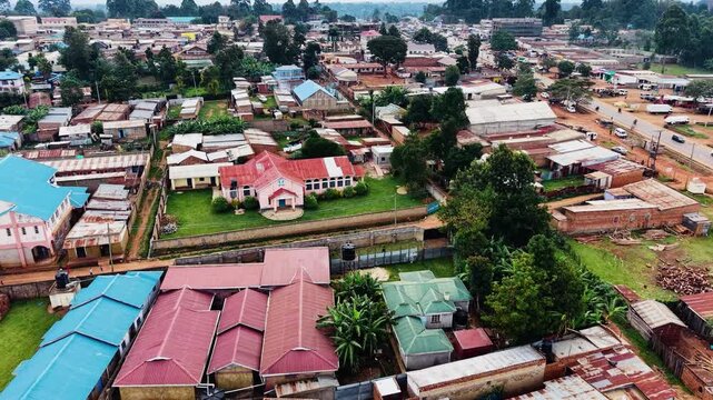 Panoramic view of the drone flying over the concentrated slum houses of rural village in Kenya. Aerial view of a poorly concentrated village in Africa slum of kiminini.