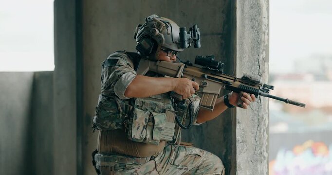 Military tactical operator moves between concrete pillars above city during urban operation