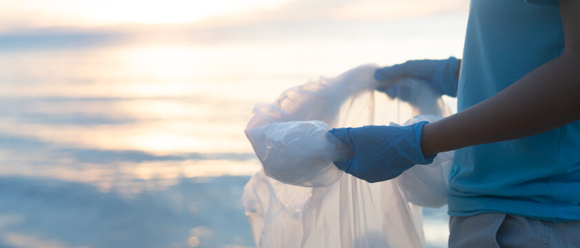 Save water. Volunteer pick up trash garbage at the beach and plastic bottles are difficult decompose prevent harm aquatic life. Earth, Environment, Greening planet, reduce global warming, Save world