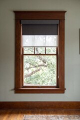 Fototapeta premium Original Wood Window With Motorized Blackout Shade and Oak Casing
