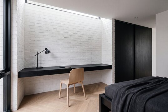 Guest Room Black Ash Desk Beneath White Brick and Clerestory Light
