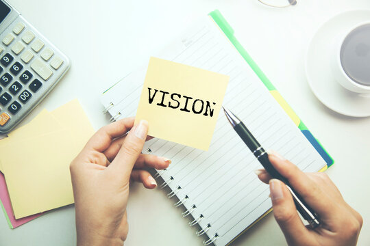 VISION word written on paper